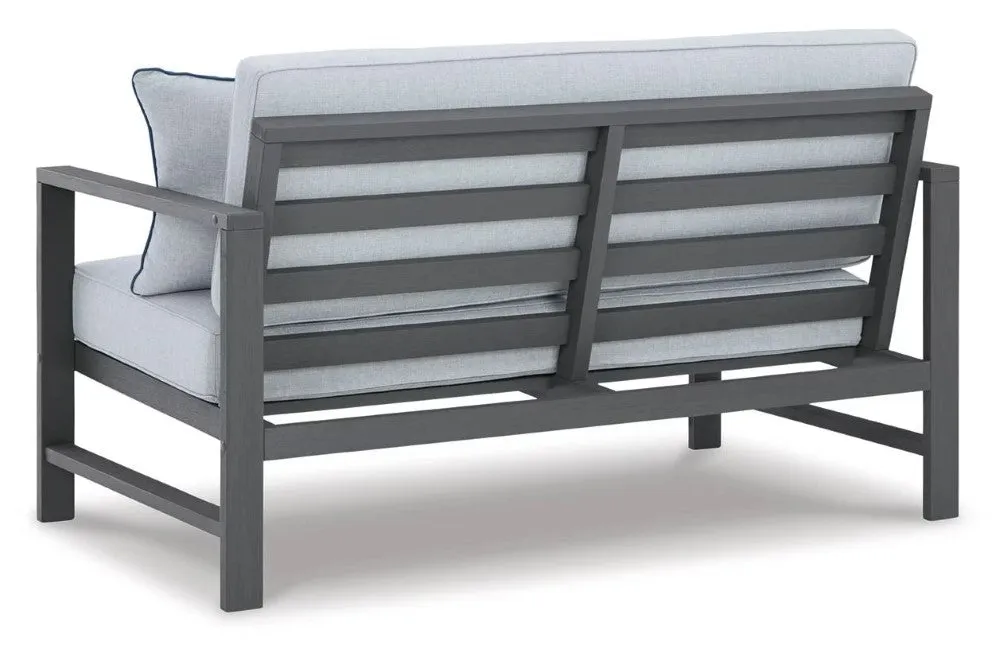Ashley Furniture Fynnegan Nuvella Outdoor Loveseat with Coffee Table